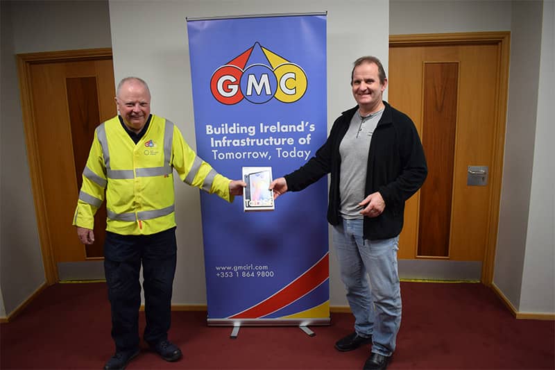 Raffle winner Jimmy Tuite (left) is presented with his Samsung Tablet by Ger Daniel